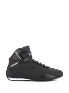 Alpinestars Sektor Shoes, Black Motorcycle Riding Shoes, side profile view, sleek high-top design with microfiber upper, ankle strap featuring white logo, speed lacing, and reinforced toe and heel areas, sport-inspired road footwear