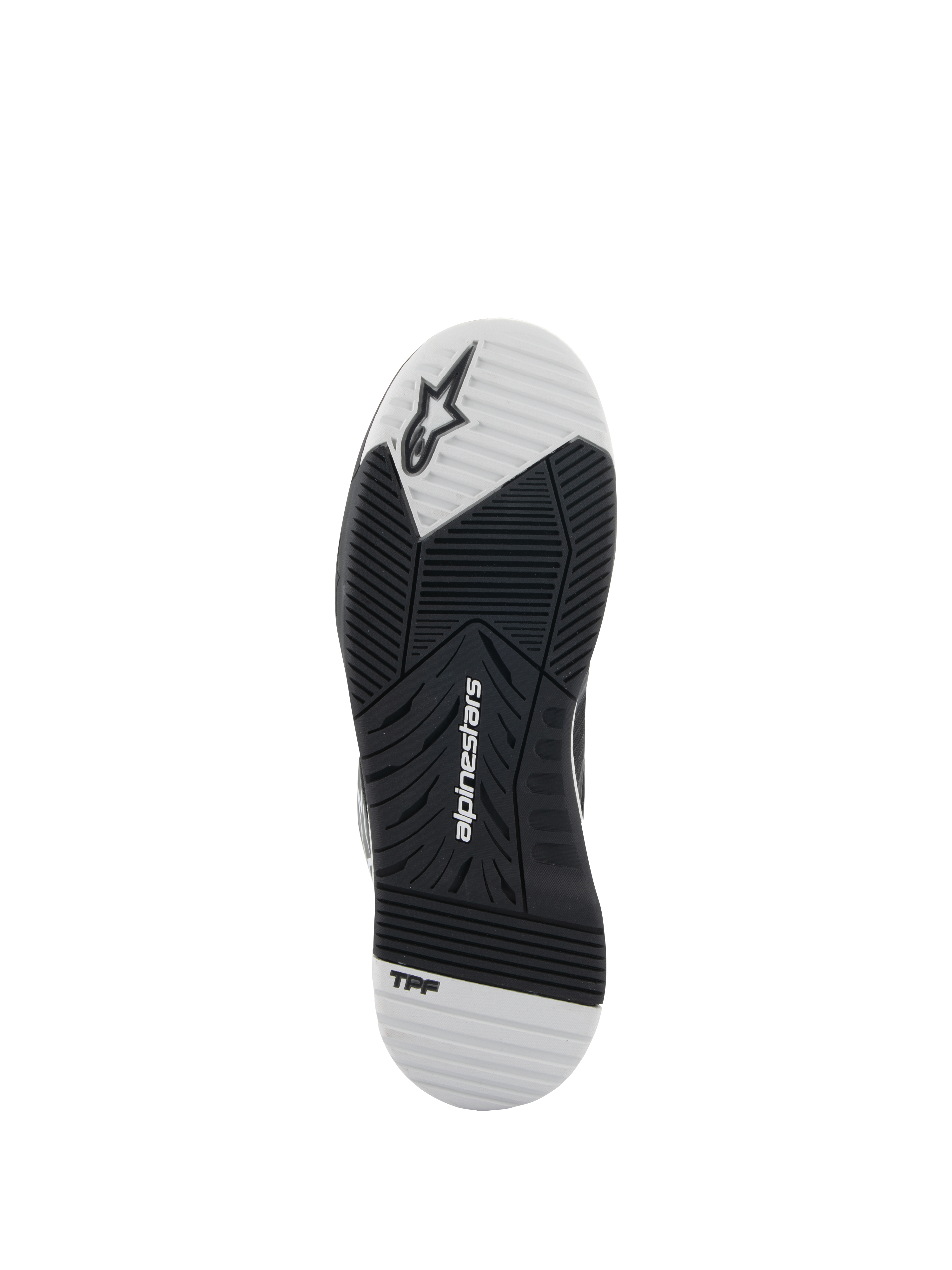 Alpinestars Speedflight-skor, svarta och vita, vy av yttersulan som visar gummisulan med dubbel densitet, Alpinestars-logotyp och TPF-märkning, asymmetriskt mönster för grepp och stabilitet vid motorcykelkörning