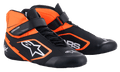 Alpinestars Youth Tech-1 K V2 Shoes, Karting Footwear, Black and Orange Fluo with White accents, high-top racing shoes featuring a dual closure system with laces and a Velcro strap, perforated microfiber construction, and bold white logo branding.