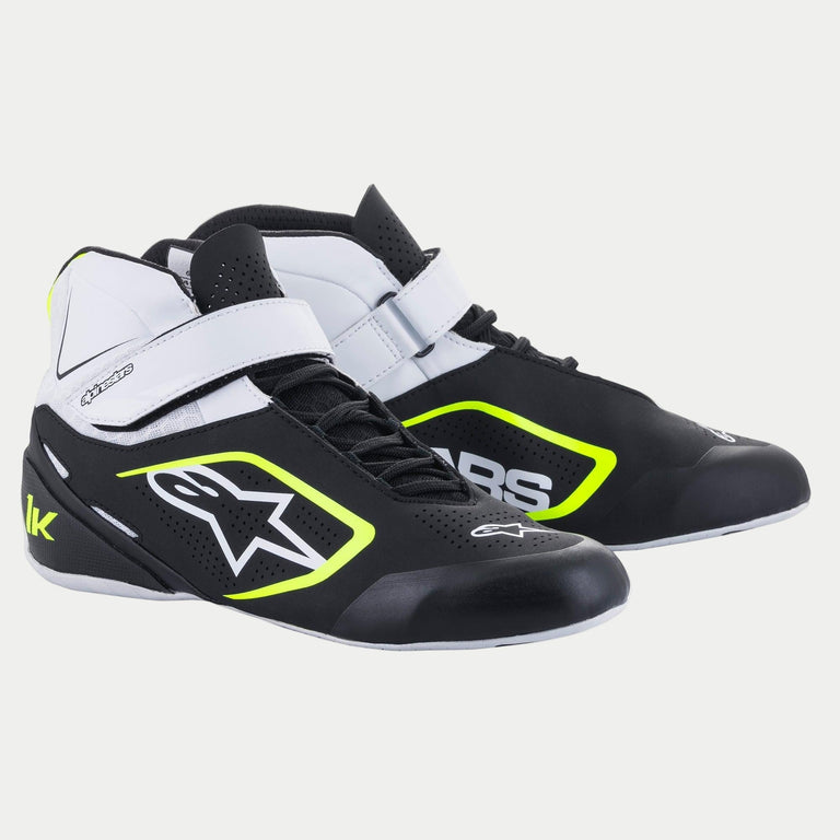 Alpinestars Tech-1 K V2 Shoes, Karting Footwear, Black White and Yellow Fluo, mid-top racing shoes featuring perforated microfiber, dual closure system with white velcro strap and laces, bold Alpinestars branding on the side.