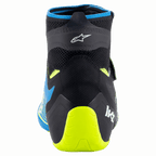 Alpinestars Tech-1 KZ V2-skor, kartingskor, Black Enamel Blue och Yellow Fluo, vy bakifrån som visar den stickade ovandelen, Alpinestars-logotyp och neongult hälstöd