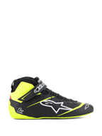 Alpinestars Tech-1 Z V3-skor FIA, racingskor för motorsport, svarta och neongula, sidoprofil av högskaftade motorsportskor, vit stjärnlogotyp, perforerad design för andningsförmåga, justerbar vristrem, tunn gummisula.