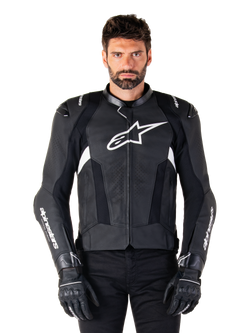 Alpinestars Missile V3 Leather Jacket, Black with White Logos, worn by a model with black riding gloves, premium leather motorcycle racing jacket with perforated ventilation panels and performance riding features