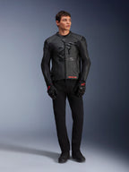 Alpinestars GP Plus R V4 Airflow Leather Jacket, Black, worn by a male model with matching black gloves and pants, featuring perforated leather panels, large tonal star logo on the chest, and sleek sport riding fit