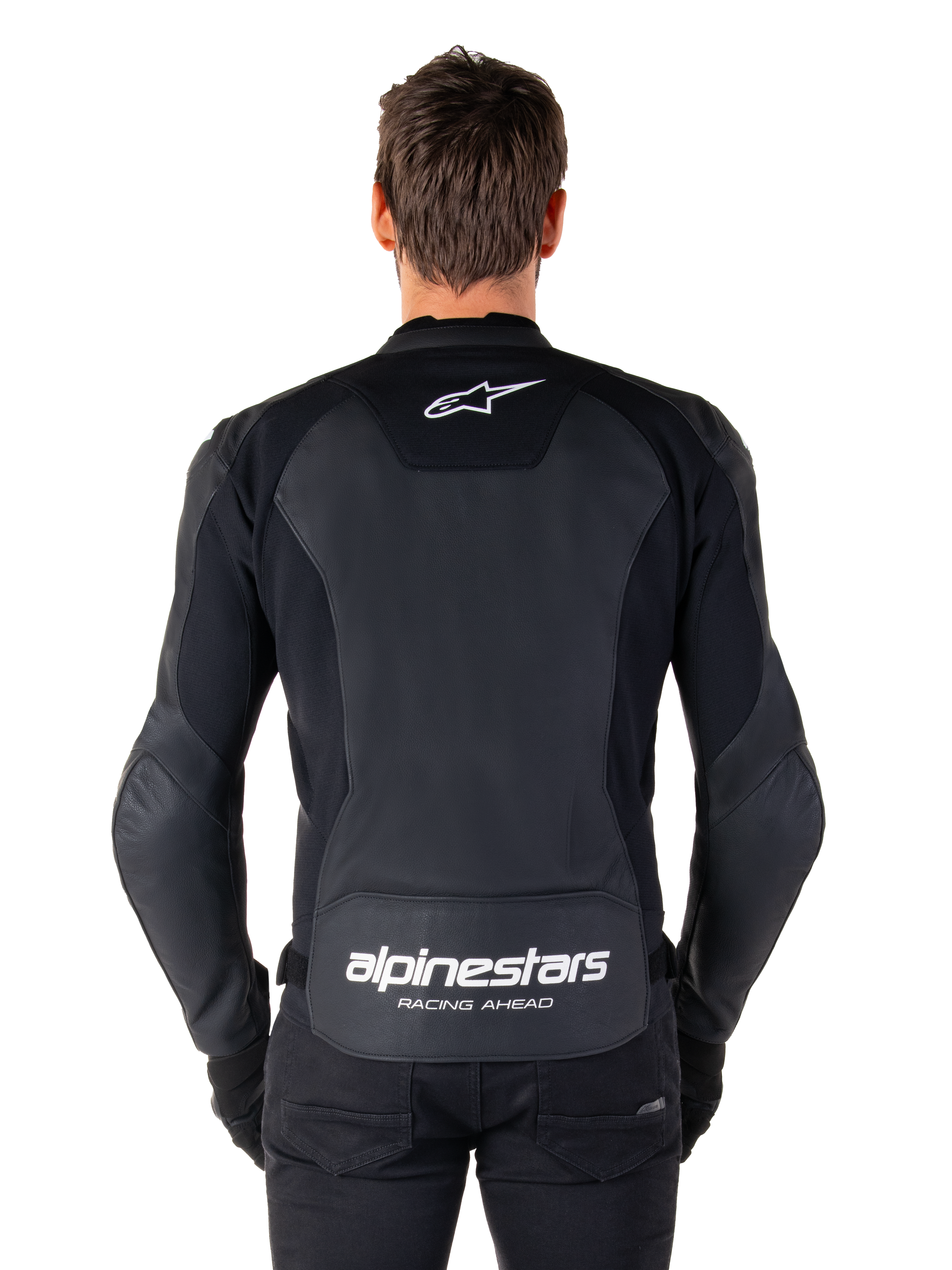 Alpinestars Faster V3 Leather Jacket, Sport Motorcycle Jacket, Black with white branding, rear view worn by model, featuring the Alpinestars logo on the upper back and 'RACING AHEAD' text on the lower back, premium leather construction with ergonomic stretch panels.