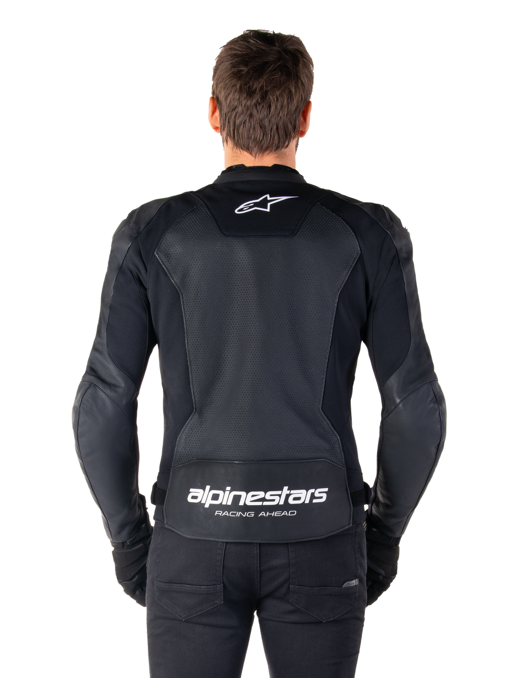 Alpinestars Faster V3 Airflow Leather Jacket, Black and White, rear view of a rider showing the perforated leather back panel for ventilation, white Alpinestars logo on upper back and 'RACING AHEAD' branding on lower back, sport-fit motorcycle gear.