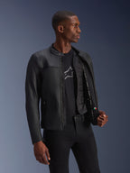 Alpinestars Blacktrack Leather Jacket, Black, premium bovine leather with a tailored fit, unzipped showing the detachable thermal vest and interior details, worn by a model, modern urban motorcycle gear
