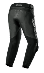 Alpinestars Missile V3 Leather Pants, Motorcycle Pants, Black, rear three-quarter view featuring premium leather construction, accordion stretch panels above the knees and waist, high rear waist, and prominent white Alpinestars branding on the side.