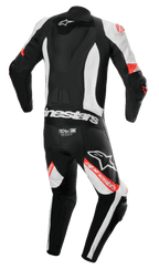 Alpinestars Missile V2 Ward 1-delat skinnställ, motorcykelställ, svart, vit och röd fluo, vy bakifrån med aerodynamisk ryggpuckel, Tech-Air Ready-logotyp på nedre delen av ryggen, dragspelspaneler och framträdande Alpinestars-logotyper på ben och rygg