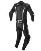Alpinestars Missile V2 2-delat skinnställ, racingställ för motorcykel, svart och vitt, vy bakifrån med aerodynamisk puckel, Tech-Air®-förberedd stretchpanel, vita linjära detaljer och Alpinestars-logotyp på ländryggen och benet