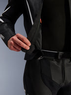 Alpinestars GP Force V2 Leather Suit - 2 Piece, close-up detail of the 360-degree waist connection zipper, black perforated leather with white accents, showing the secure attachment system between jacket and pants.