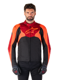 Alpinestars T-Jaws V4 Waterproof Jacket, Sport Textile Motorcycle Jacket, Black with Red Fluo and Dark Red accents, worn by a male model with matching gloves, technical riding gear with prominent star logo on the chest.