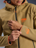 Alpinestars Aeroshell Waterproof Jacket, Dark Khaki and Orange Fluo, close-up of the front and sleeve featuring orange ASTARS logos, orange piping on the hood and cuffs, and a black waterproof zipper.