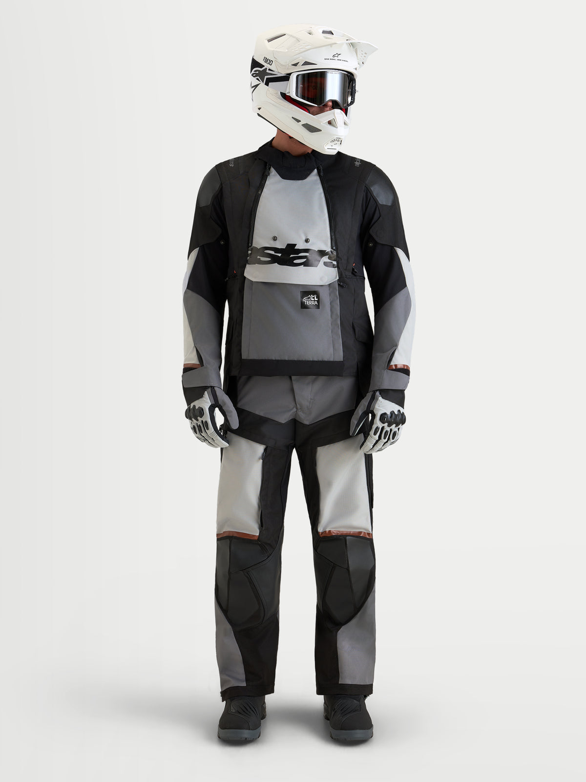 Alpinestars Harok V2 Drystar® Gear Set, adventure touring motorcycle jacket and pants, black and gray, worn by a model with an off-road helmet and gloves, all-weather waterproof riding apparel