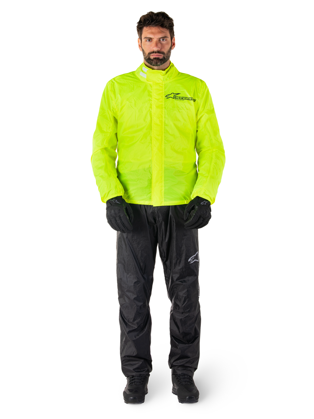 Alpinestars Hurricane Rain V2 jacka och byxor, neongult och svart vattentätt regnställ för motorcykel buret med svarta handskar och stövlar, med Alpinestars-logotyp på bröstet och benet