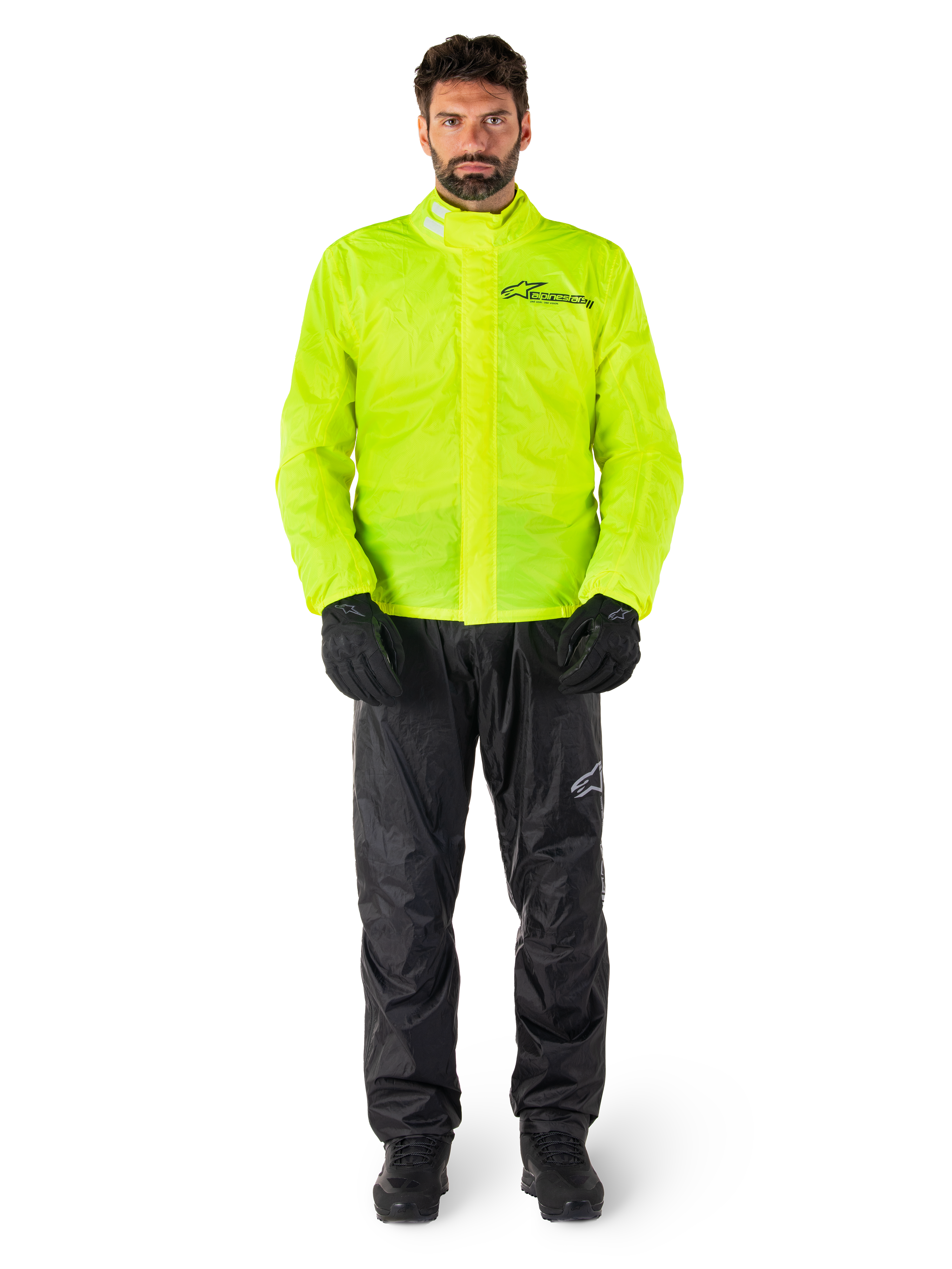 Alpinestars Hurricane Rain V2 jacka och byxor, neongult och svart vattentätt regnställ för motorcykel buret med svarta handskar och stövlar, med Alpinestars-logotyp på bröstet och benet