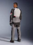 Alpinestars Andes V4 Drystar® Jacket, Dark Gray and Ice Gray with Black and Bright Red accents, back view showing light gray panel with red star logo, paired with matching adventure pants and black gloves, technical all-weather motorcycle gear.