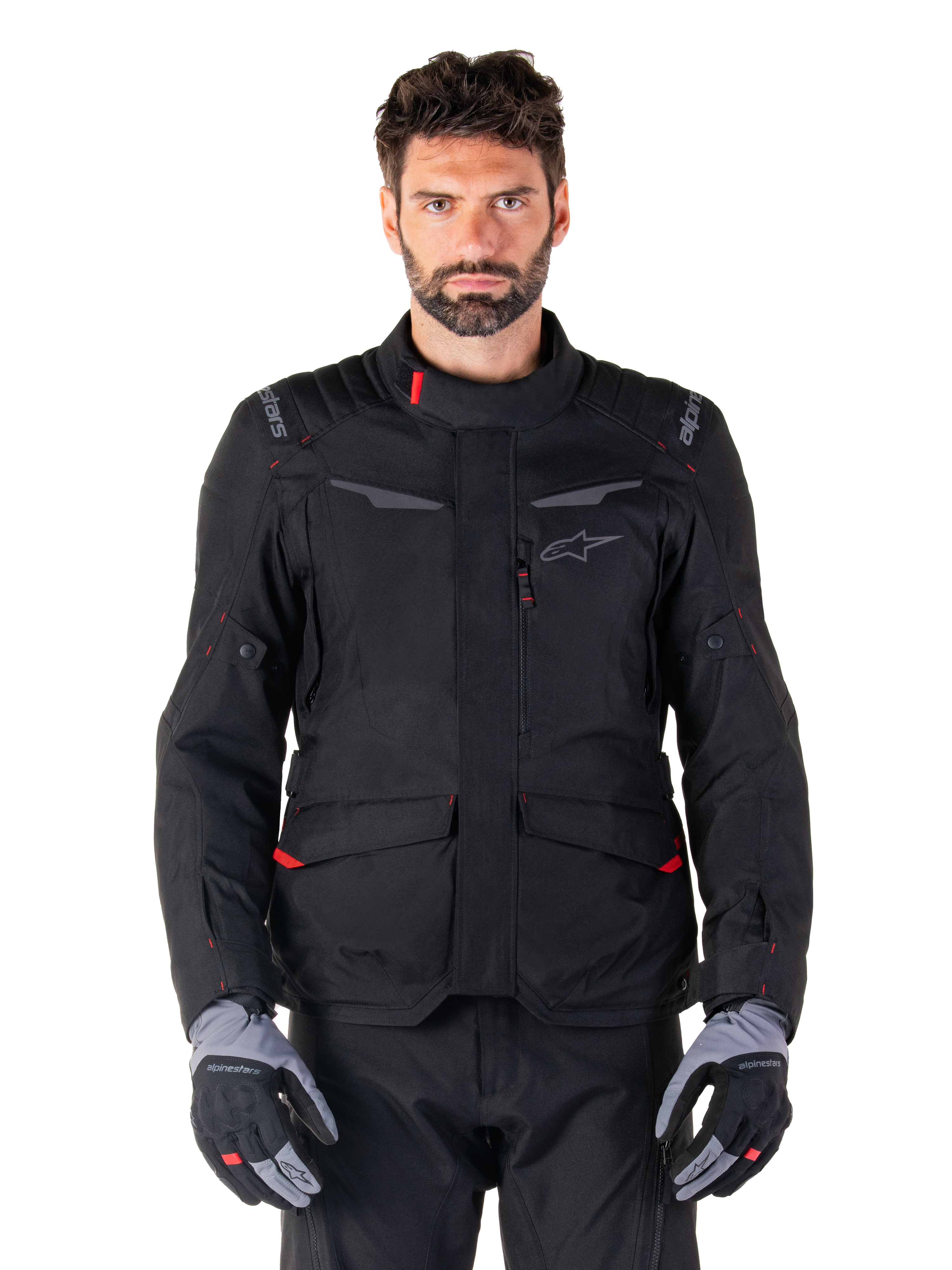 Alpinestars ST-1 Waterproof Jacket, Motorcycle Touring Jacket, Black with Red Accents, High Collar, Multiple Pockets, Textured Durable Material, Worn with Black Pants and Gray Gloves