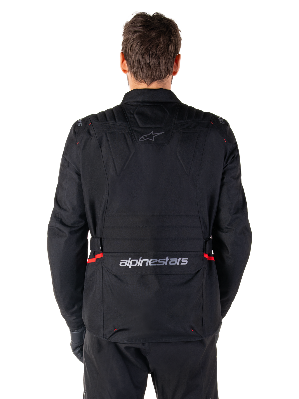 Alpinestars ST-1 Waterproof Jacket, Black, Back View, adventure touring motorcycle jacket featuring red accents on the waist, Alpinestars logo on the upper back, and wordmark on the lower back flap
