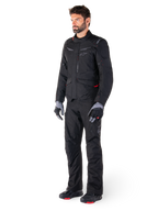 Alpinestars ST-1 Waterproof Jacket, Black, adventure touring jacket with red accents, worn with matching black pants, gloves and boots, full body view of rider in complete all-weather gear set