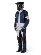 Alpinestars ST-1 Waterproof Jacket, Adventure Touring Jacket, Dark Blue Black and Bright Red, worn by a rider with matching pants, black adventure helmet, gloves, and boots, featuring grey panels and red accents, streamlined adventure-inspired design with Alpinestars logos