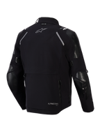 Alpinestars Andes Pro Drystar® XF jacka, baksida, svart och mörkgrå, adventure touring-textiljacka med en stor bakre förvaringsficka, reflekterande axeldetaljer, Alpinestars-logotyp och Tech-Air®-kompatibilitetsmärkning.
