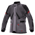 Alpinestars Monteira Drystar XF Jacket, Motorcycle Touring Jacket, Dark Gray and Tar Gray with Black panels and Bright Red accents, featuring front cargo pockets, adjustable waist and arm straps, vertical Alpinestars branding, and a high collar, designed for adventure riding