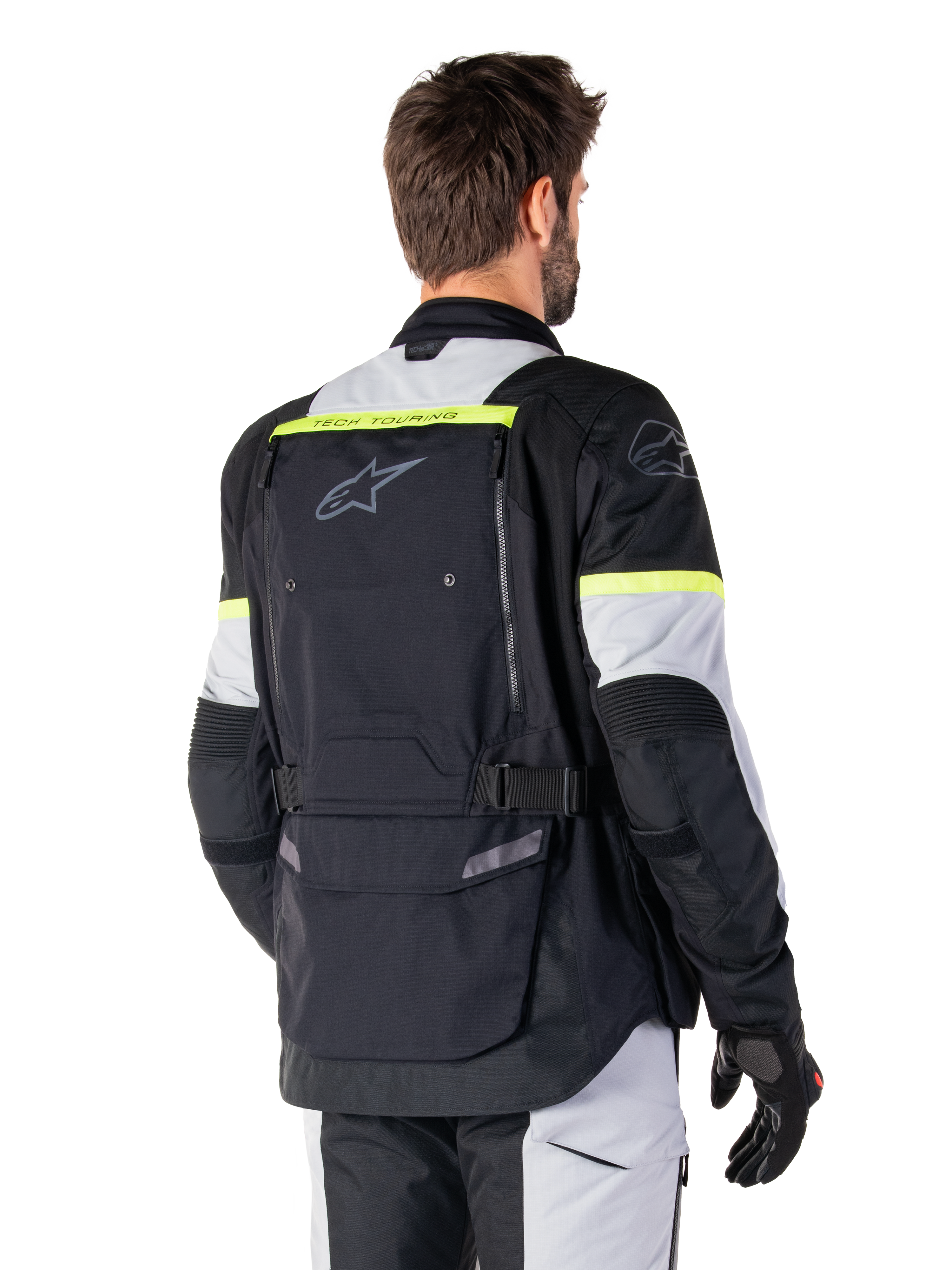 Alpinestars Bogotá Pro Drystar®-jacka, adventure touring-jacka, Black Ice Gray och Yellow Fluo, vy bakifrån med stor ryggficka med 'TECH TOURING'-logotyp, Alpinestars-logotyp och fluorescerande detaljer, teknisk mc-utrustning i textil