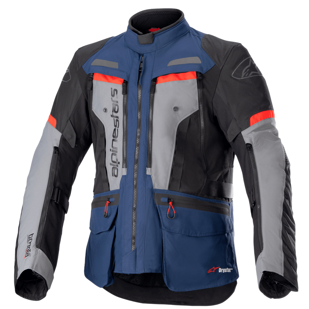 Alpinestars Bogota Pro Drystar-jacka, äventyrstouringjacka för motorcykel, mörkblå och svart med grå bröstpaneler och klaröda detaljer, med vattentät textilkonstruktion, flera ventilationsdragkedjor och praktiska fickor.