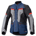 Alpinestars Bogota Pro Drystar-jacka, äventyrstouringjacka för motorcykel, mörkblå och svart med grå bröstpaneler och klaröda detaljer, med vattentät textilkonstruktion, flera ventilationsdragkedjor och praktiska fickor.