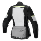 Alpinestars Stella Andes Air Drystar® jacka, touringjacka för dam, sedd bakifrån, Ice Gray, Dark Gray och svart, med en stor vit ryggpanel i mesh, grå förvaringsficka bak med logotyp, gula hi-viz-detaljer och textilkonstruktion för luftflöde och skydd.