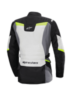 Alpinestars Stella ST-1 vattentät jacka, baksida, touringjacka för damer, Ice Gray, svart och gul fluo, Alpinestars-logotyp på nedre delen av ryggen och i nacken, adventure touring-design med skyddande textilkonstruktion och fluorescerande detaljer
