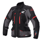 Alpinestars Stella Honda Andes V3 Drystar damjacka, motorcykeljacka för touring, svart och grå med klarröda detaljer, Honda Wing-logotyp på bröstet, röda dragkedjor, justerbara remmar i midja och på ärmar, samt slitstark vattentät konstruktion