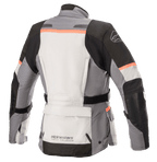 Alpinestars Stella Andes V3 Drystar® damjacka, motorcykeljacka, isgrå, mörkgrå, svart och korall, vy bakifrån med en stor förvaringsficka i ländryggen, justerbart midjebälte och korallfärgade detaljer på axlar och rygg.