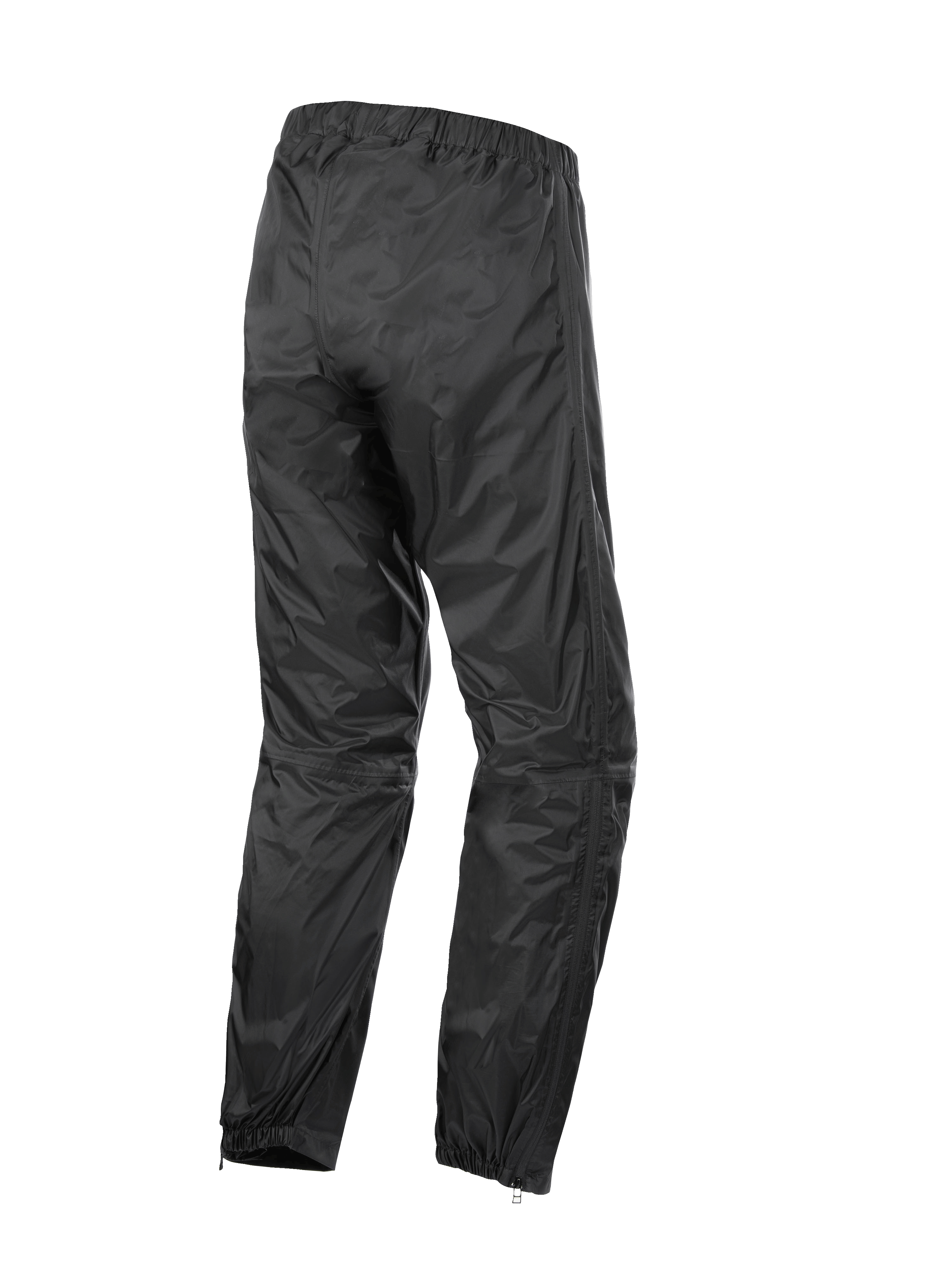Alpinestars Hurricane Rain V2 Pant, vattentäta regnbyxor för motorcykel, svarta, vy bakifrån som visar elastiskt midjeband och muddar, lätt vindtåligt laminerat tyg med dragkedjor vid bensluten för enkel åtkomst till stövlar, skyddsutrustning för väg- och äventyrstouring