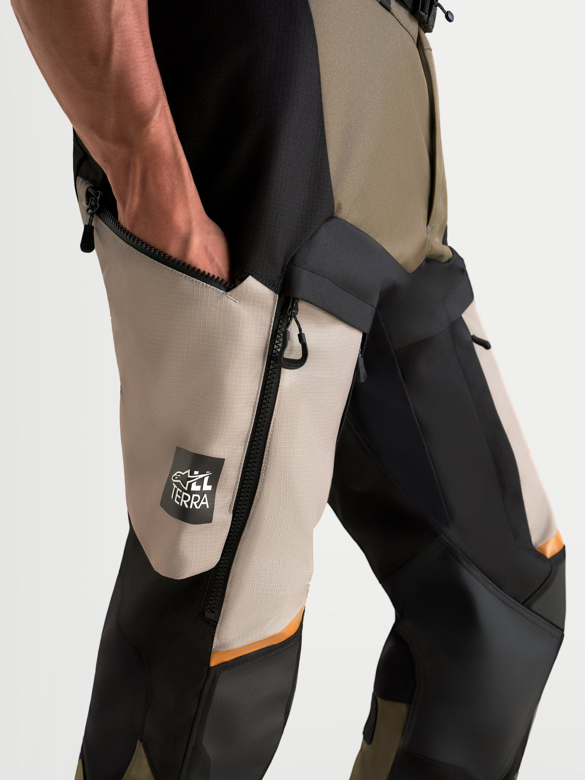 Alpinestars Harok V2 Drystar Pants, Adventure Motorcycle Pants, Aluminum, Walnut, and Black, featuring a functional thigh pocket with All Terra branding, waterproof ripstop construction, and CE certified protection