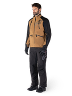 Alpinestars Hyde XT Drystar® Pants, Adventure Motorcycle Pants, Black, worn with a brown and black technical jacket, black gloves and boots, featuring an over-the-boot design for off-road and dual-sport riding