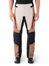 Alpinestars ST-1 Waterproof Pants, Motorcycle Touring Pants, Sand and Dark Khaki with Black panels and Red Fluo orange accents, featuring zippered front pockets and reinforced knees, textile adventure gear for all-weather riding