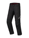 Alpinestars Honda ST-1 Waterproof Pants, motorcykelbyxor för touring, svarta med röda detaljer på insidan, cargofickor med dragkedja på låren, ergonomiskt förböjda ben med förstärkta knän, vattentät adventure-utrustning i textil