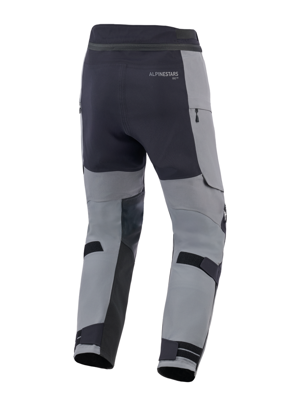 Alpinestars Andes Pro Drystar® XF byxor, äventyrsmotorcykelbyxor, mörkgrå och svarta, vy bakifrån med justerbara vadremmar, Alpinestars-logotyp och vattentäta dragkedjedetaljer