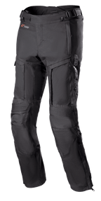 Alpinestars Bogota Pro Drystar 3 Seasons Pants, Black Motorcycle Touring Pants, featuring zippered ventilation on thighs, accordion stretch panels at knees, adjustable waist straps, and durable textile fabric with Drystar branding.