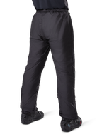 Alpinestars Bogota' Pro Drystar® 3 Seasons Pants, Black adventure touring motorcycle pants, rear view of the waterproof Drystar® liner worn as over-pants, paired with black motorcycle boots, technical lightweight construction for multi-season weather protection