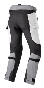 Alpinestars Bogota' Pro Drystar® 4 Seasons Pants, Adventure Touring Pants, Ice Gray and Dark Gray, rear view featuring waist connection zipper, cargo-style panels, and adjustable calf straps for a secure fit