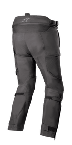 Alpinestars Bogotá Pro Drystar® 4 Seasons Pants - Short, Adventure Touring Motorcycle Pants, Black, rear view showing high waist with logo, stretch accordion panel, adjustable calf straps, and technical textile construction.