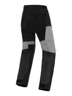 Alpinestars Stella Andes V4 Drystar® byxor, äventyrsbyxor för damer, svarta och mörkgrå, bakifrån sedda med grå paneler på benens baksida, slitstarka ripstop-förstärkningar vid sätet och stretchzoner för rörlighet i en vattentät textildesign.
