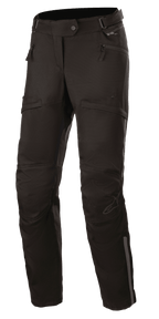 Alpinestars Stella AST-1 V2 Waterproof Pants, Women's Motorcycle Touring Pants, Black, featuring zippered hand pockets, reinforced knee panels, adjustable waist belt, and reflective accents.