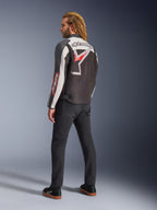 Alpinestars Axton Jacket, Motorcycle Jacket, Black Off White and Bright Red, rear view worn by male model, featuring large Alpinestars star logo and wordmark across the back, vintage racing-inspired design with accordion panels, paired with black pants and sneakers