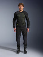 Male model wearing Alpinestars Troop-Air Jacket in Black Yellow Fluo, featuring technical mesh panels and bright yellow accents, paired with black riding pants and shoes, contemporary motorcycle apparel for warm weather