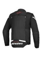 Alpinestars T-Stunt Air Jacket, Rear View, Black and White, featuring a red star logo on the neck, white branding at the lower back, and vertical zippers for the modular airflow system.