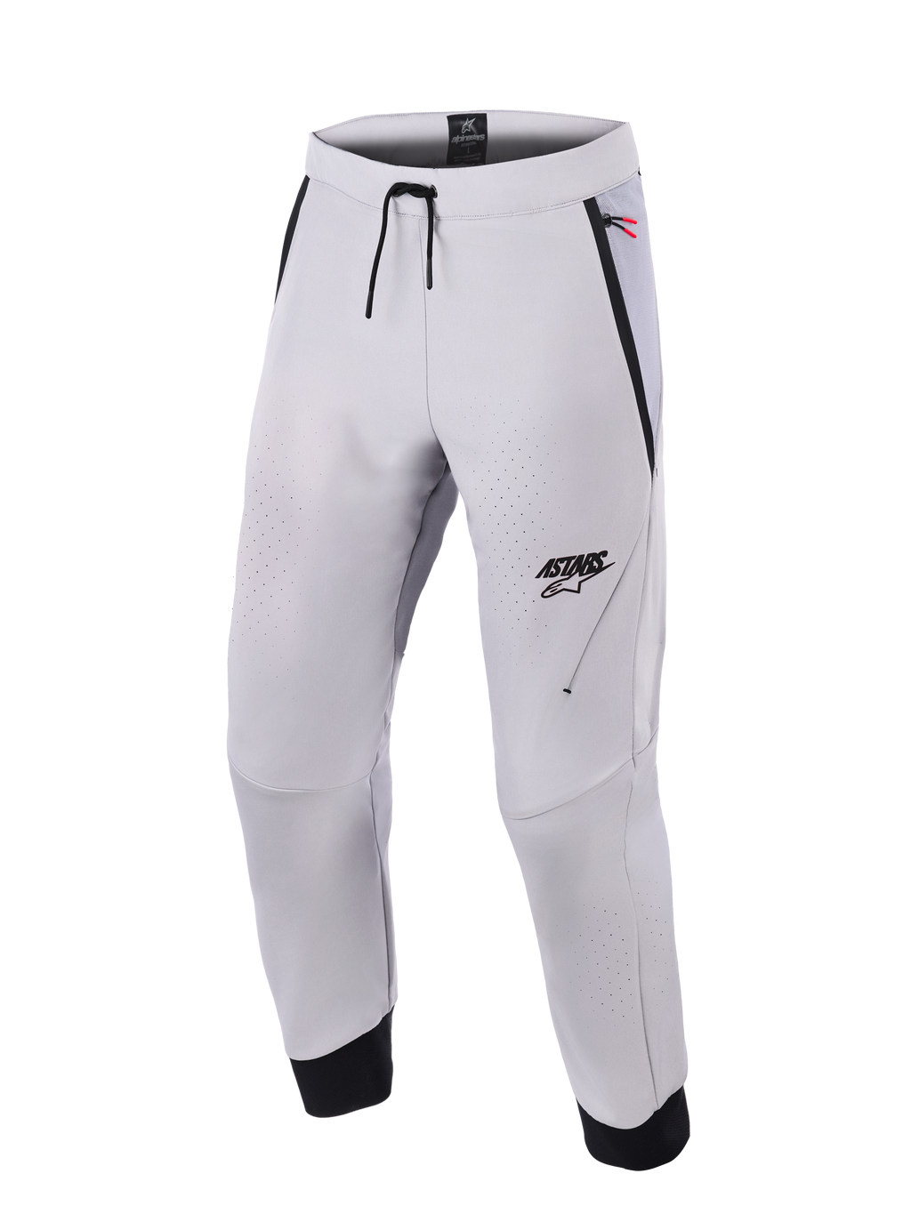 Alpinestars Aeroshell Airflow byxor, mellangrå motorcykelbyxor med laserperforerade ventilationszoner, ASTARS-logotyp på vänster lår, midja med dragsko och svarta ankelmuddar, teknisk softshelldesign för sport- och stadskörning